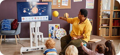 Kids watching teacher on screen