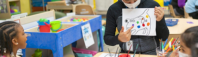 Boy painting in class